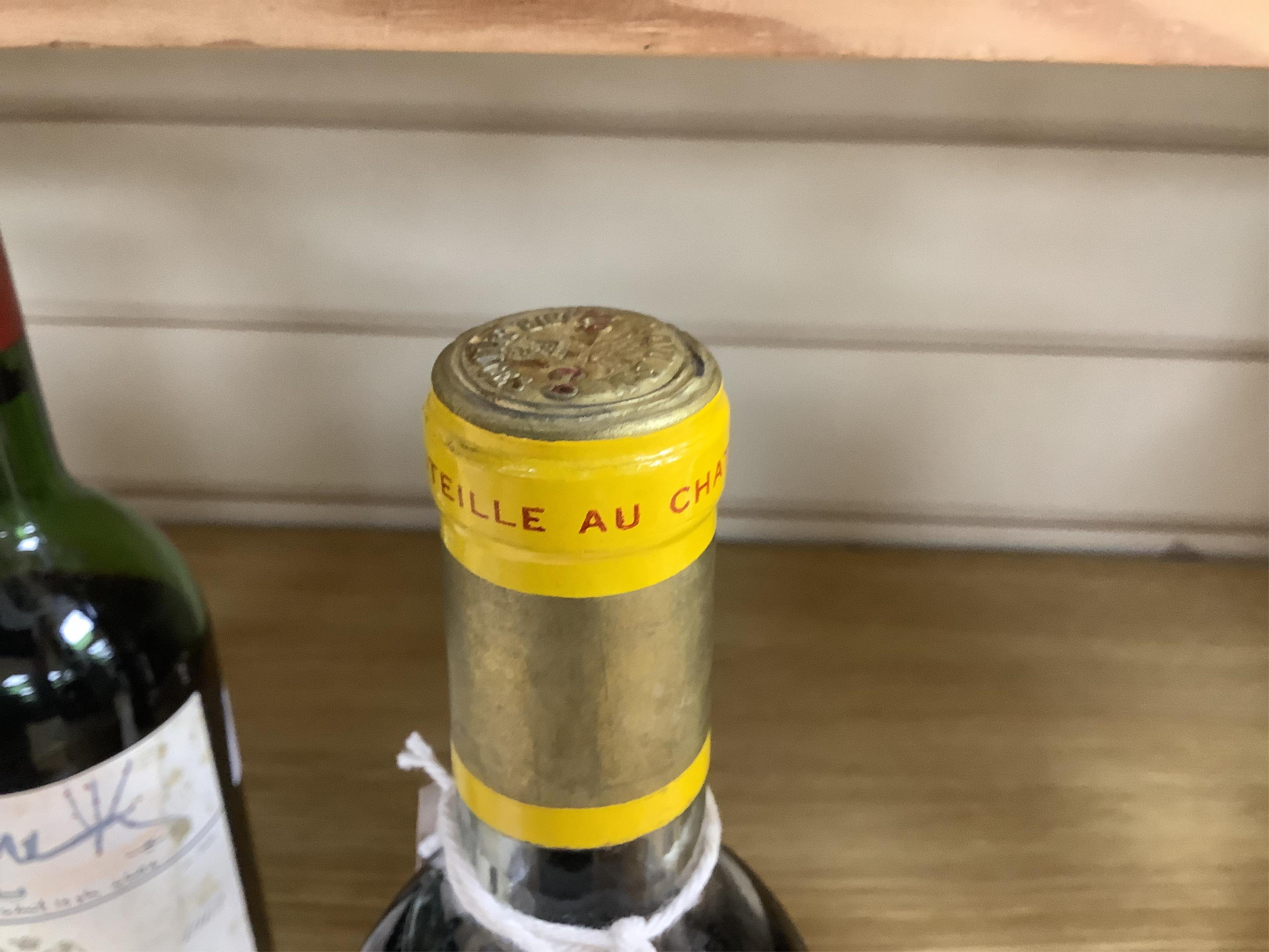 A bottle of Chateau d'Yquem, 1969. Condition - fair, level just above mid shoulder, label poor